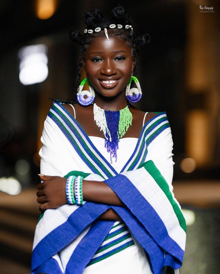 An image showing a lady wearing traditional clothing of Sierra Leone