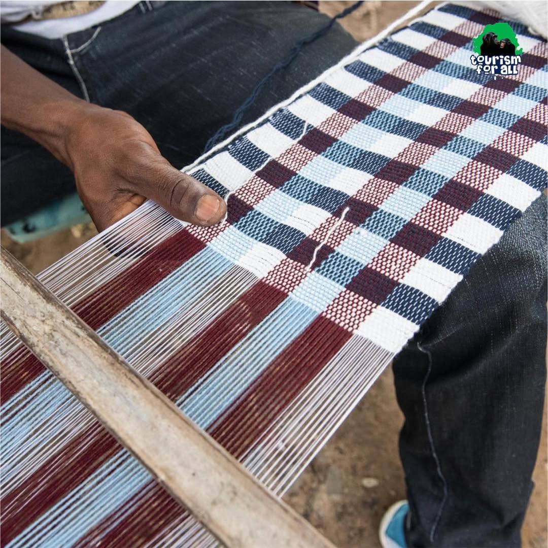 An image showing a weaver making the traditional clothing of the Mende people

