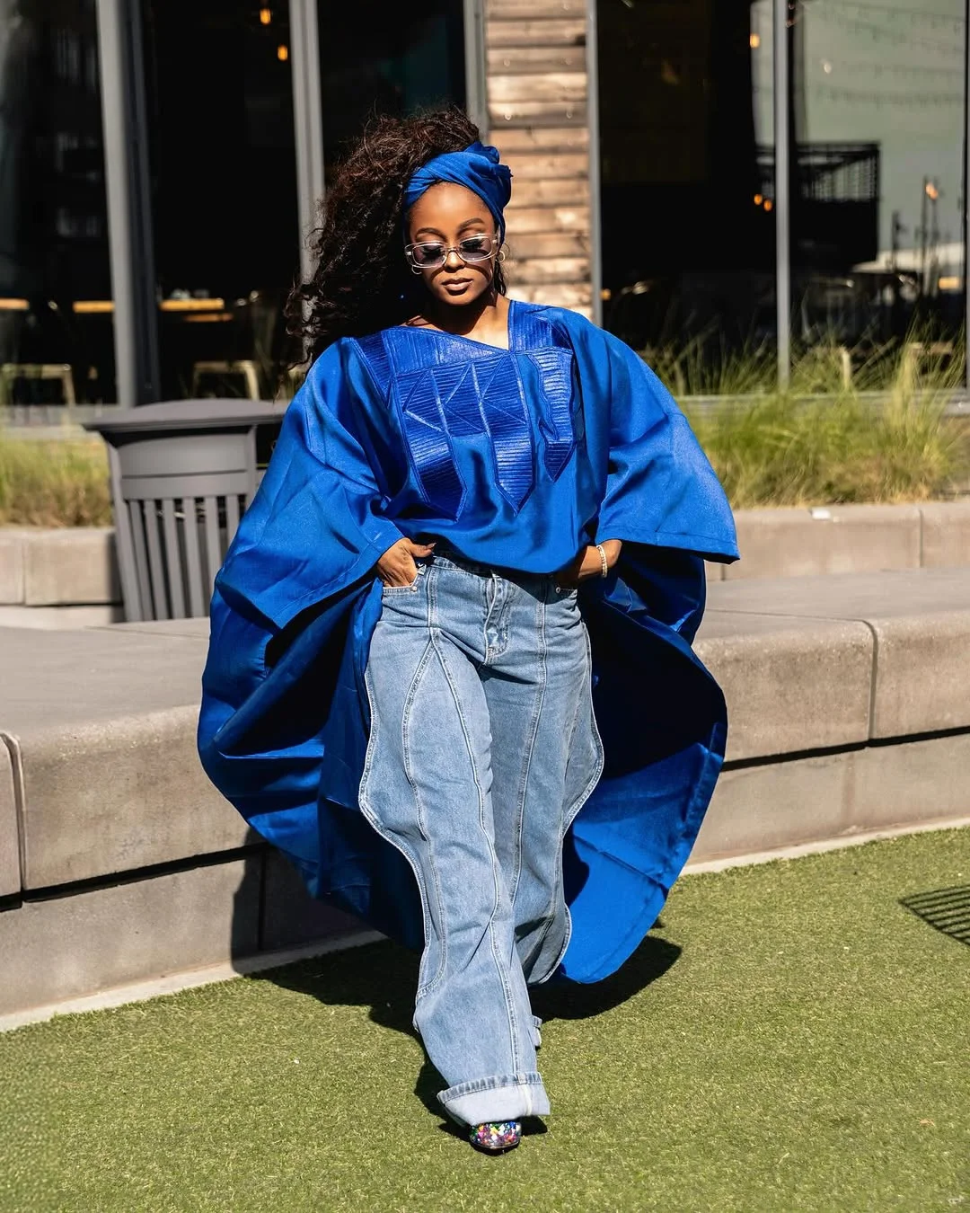 An image showing Vanessa wearing an abagda with a denim trouser