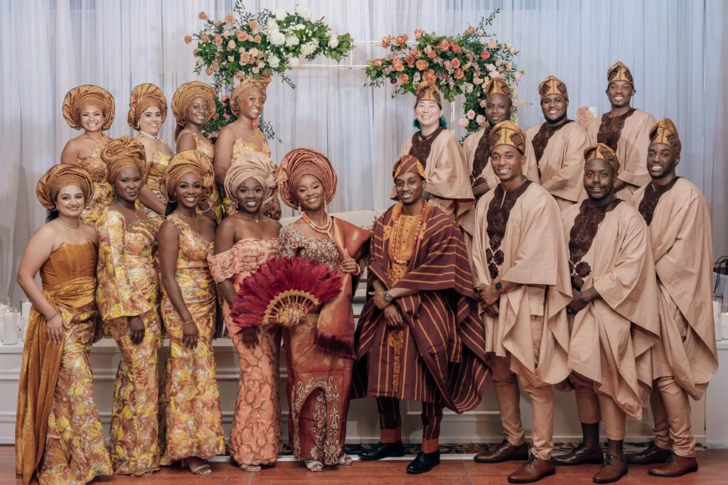 An image showing a bridal train wearing aso ebi, one of the UK diaspora dress codes