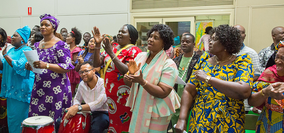 An image showing Africans in a church in diaspora, revealing one of the UK diaspora dress codes