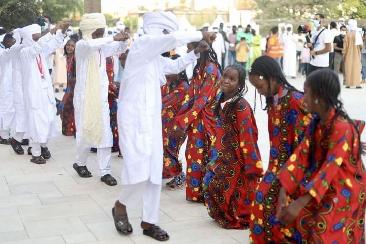 An image showing some people wearing Toubou traditional dress 
