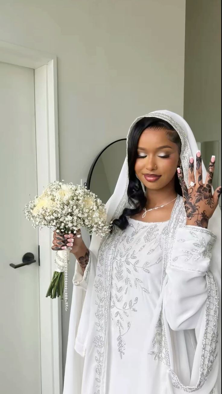 Somali bride in modest Guntiino styling for Nikkah ceremony in diaspora wedding.