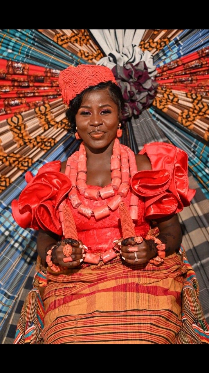 An image showing a woman in traditional attire and coral bead accessories associated with Ijaw and Kalabari Dress.