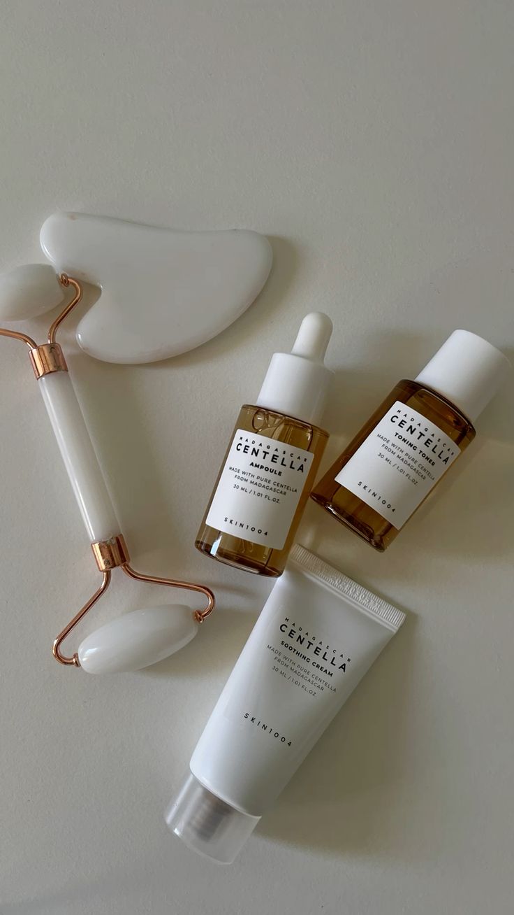 Simple Madagascar Centella skincare routine with ampoule, moisturiser, sunscreen, and fresh Centella leaves.