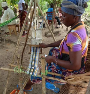An image showing women making Liberian country-cloth
