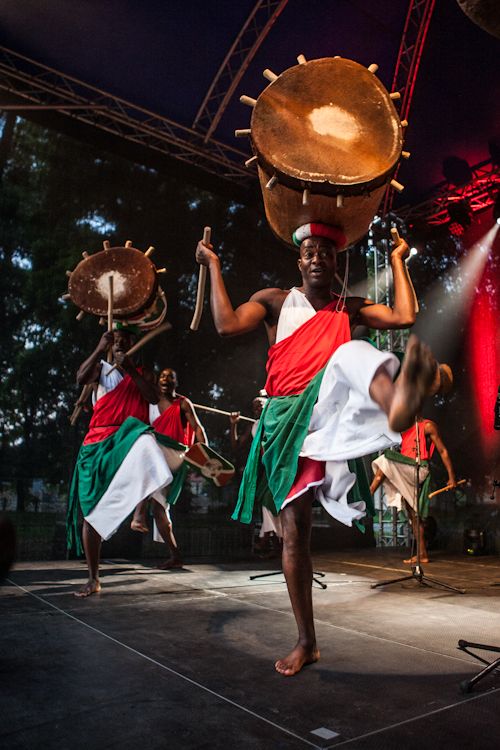 Group of Burundi Intore dancers in ceremonial with traditional drums and regalia.