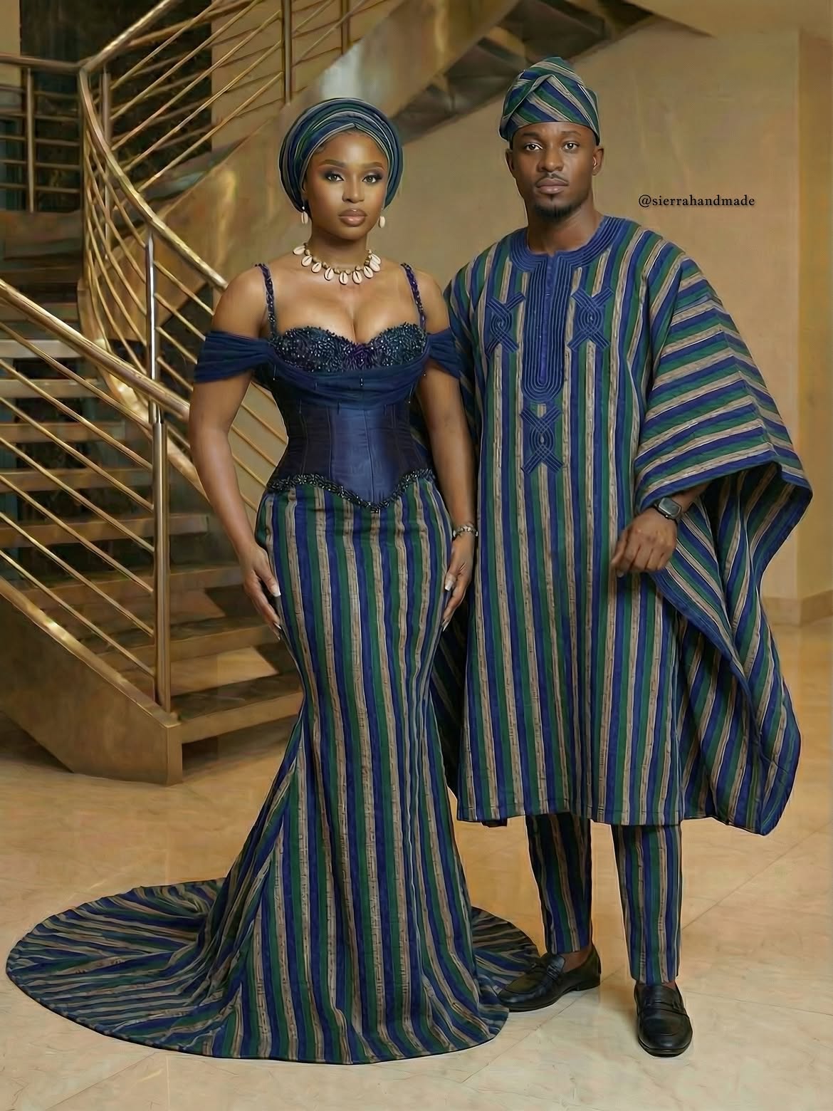 An image of a couple wearing blue, and green striped country cloth outfits, styled with coordinated headwear.
