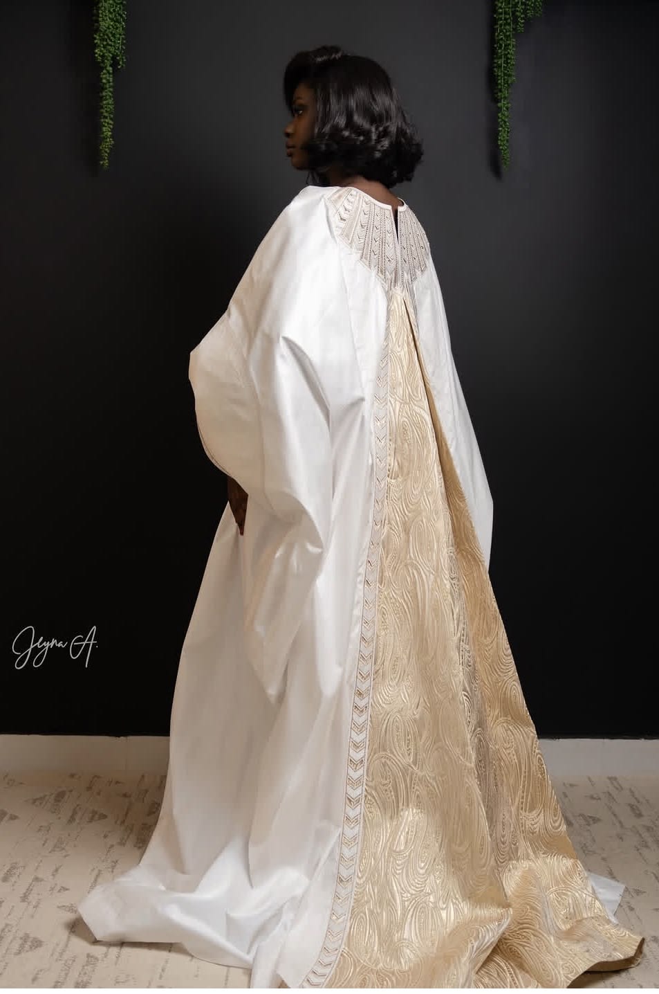 Young Senegalese designer reinterpreting the boubou sleeve as a sculptural contemporary fashion piece.