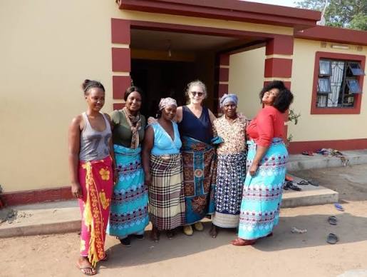 An image showing women wearing Mozambican Capulana Wrap around the waist